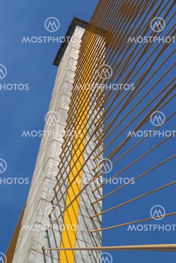 Detail of bridge construction over blue sky