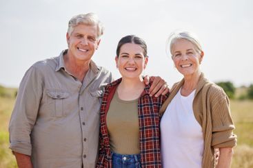 Family, portrait and woman with senior parents, farm and...