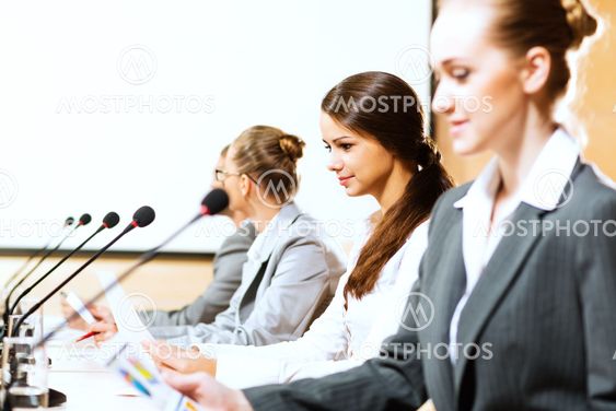 businessmen communicate at the conference