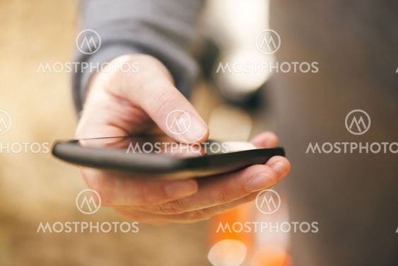 Close up of female hand with mobile smartphone