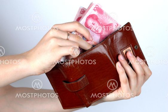 Holding Chinese money and wallet