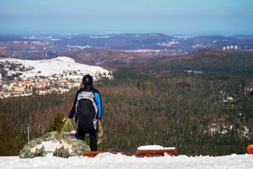 Paraglider preparing for winter mountain flight