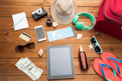 close up of tablet pc and travel stuff