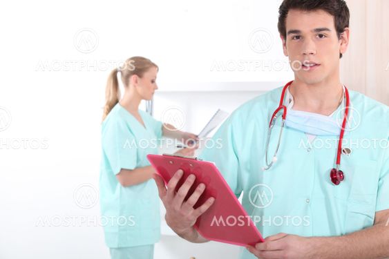 Young medic with a clipboard