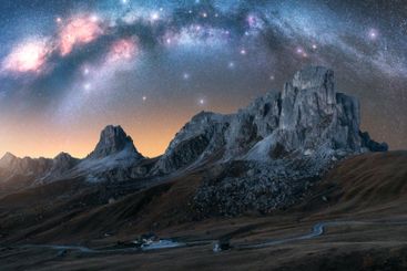 Milky Way galaxy over alpine mountains on summer starry...