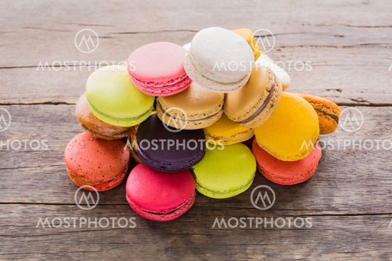 French colorful macarons on wood table