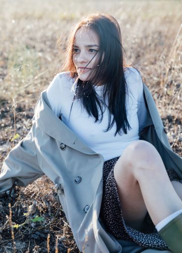 Beautiful fashionable brunette woman in gray coat...