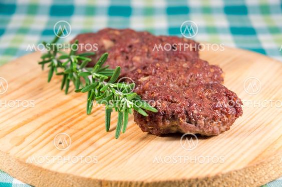 Cevapcici on a wooden dish