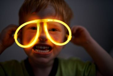 Night, child and neon glasses in portrait for fun,...