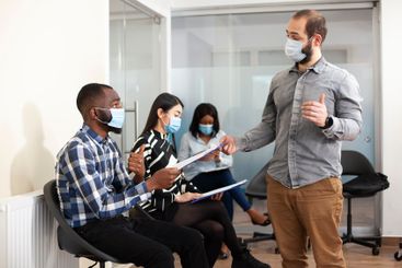 Caucasian manager collecting cv resumes