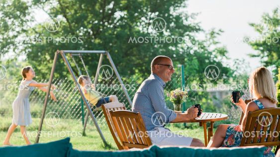 Young family enjoying a day in the backyard