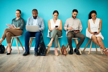 Business people, waiting room or research with...