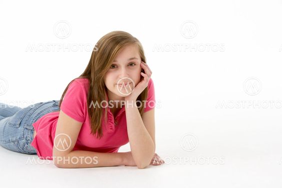 Teenage Girl Laying On Stomach