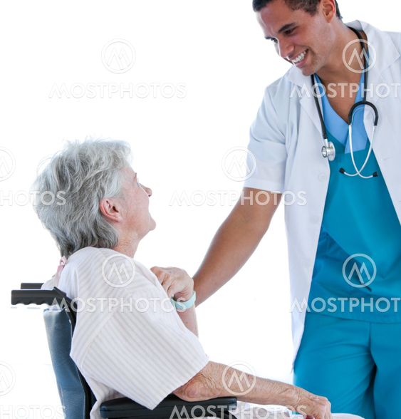 Senior patient sitting on a wheelchair talking with her doctor