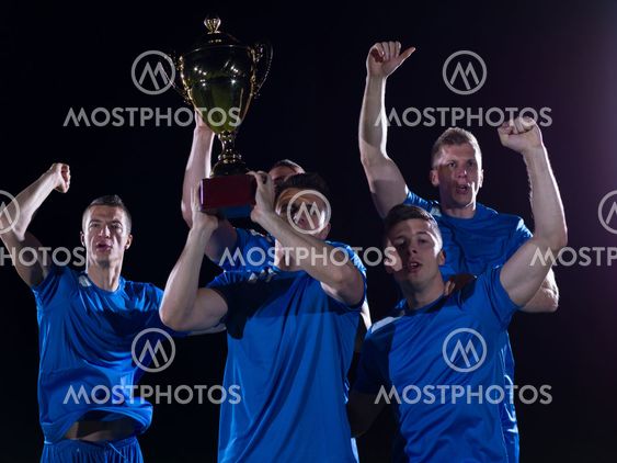 soccer players celebrating victory