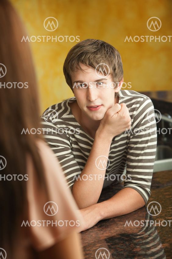 Young Man Talks to Woman