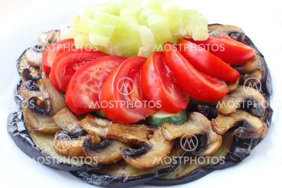 Vegetables and mushrooms on white plate
