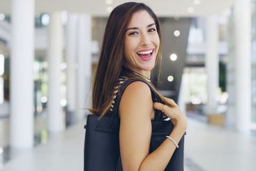 Walking, smile and portrait of businesswoman in lobby...