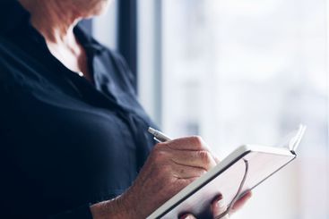 Notes, writing and hands of business person in office...