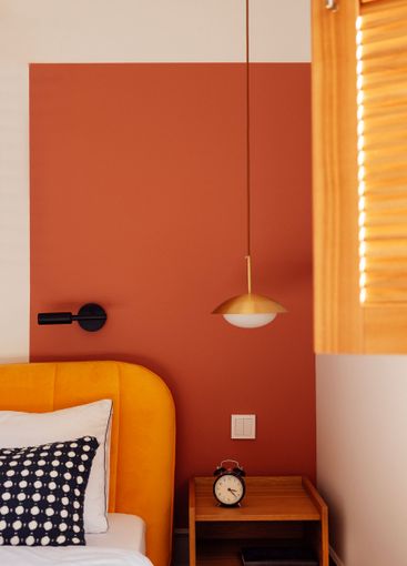 Close-up of wooden laconic classic bedside table with...