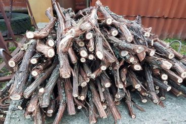 Stacked twigs ready for a cozy evening by the fire,...