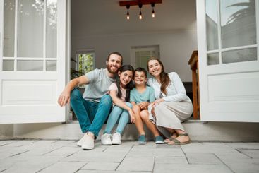 Parents, children and happy in new home for portrait,...