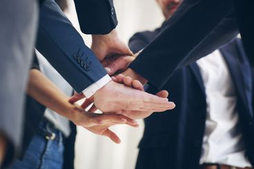 Business people, huddle or hands together for success,...