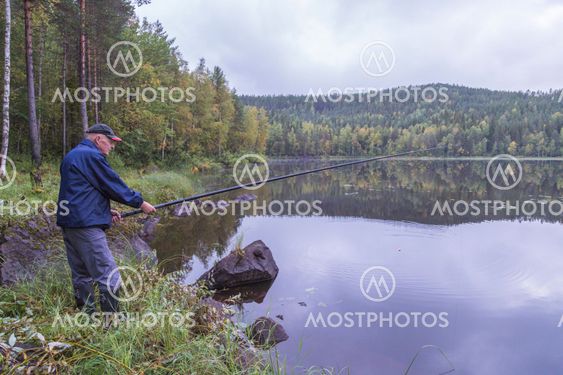 Man fishing at small lake