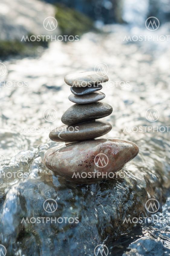 stone balance on rock in the river