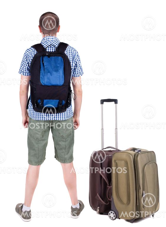 Back view of young man traveling with suitcas.