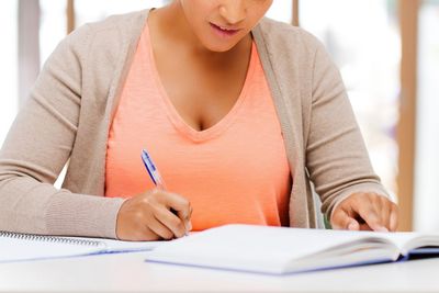 african american female student with notebook