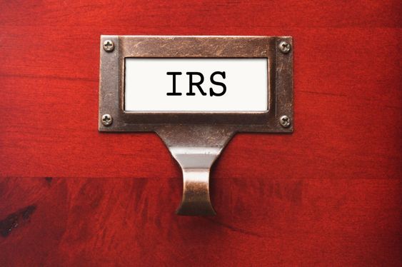 Lustrous Wooden Cabinet with I.R.S. File Label