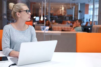 businesswoman using a laptop in startup office