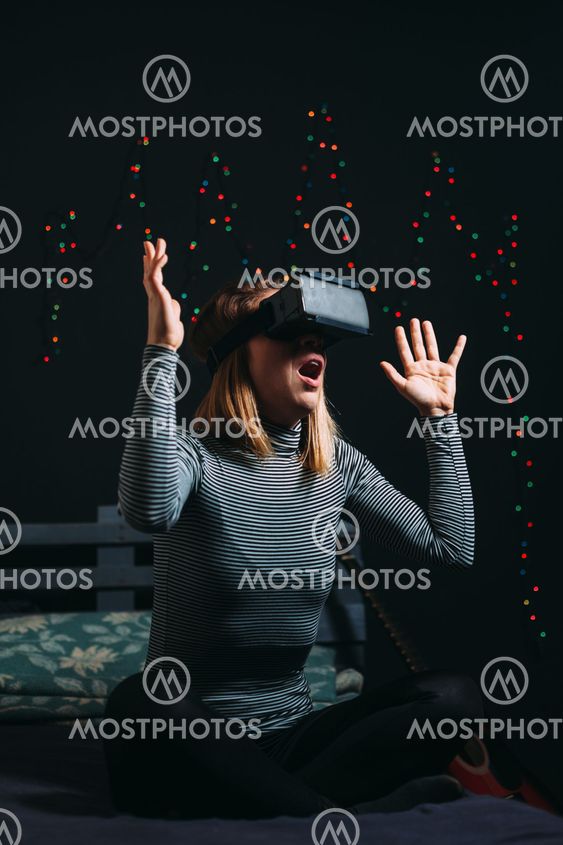 Young woman wearing virtual reality glasses