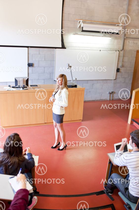 Concentrated students listening to their teacher at university