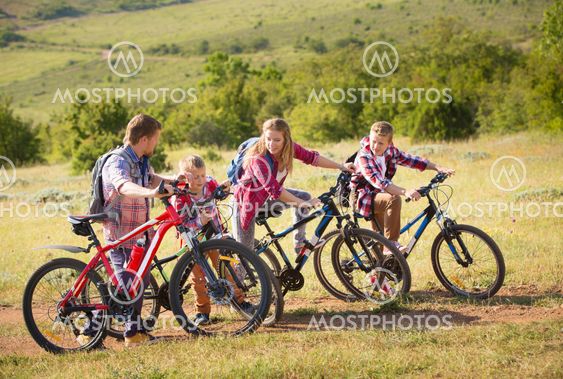 Family riding bikes in the mountains