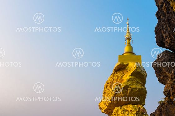 pagoda on rock stone with blue sky