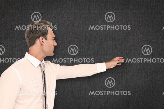 Composite image of businessman reaching