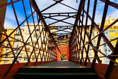 Iron bridge and coloured houses in Girona