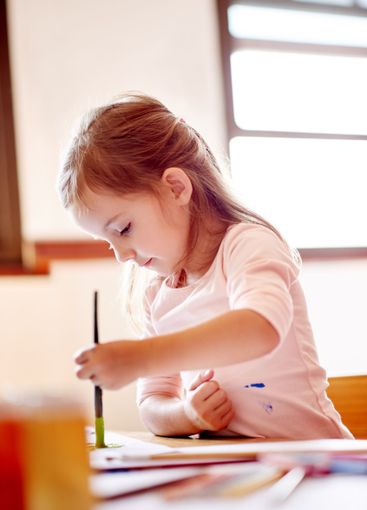 Creative, painting or child in house with brush for...