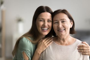 Close up headshot two diverse beautiful women posing for...