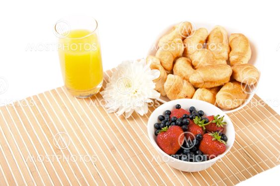 Breakfast with berries,orange juice and croissant
