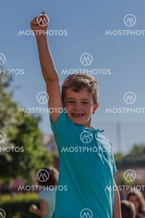 Boy raising his arm