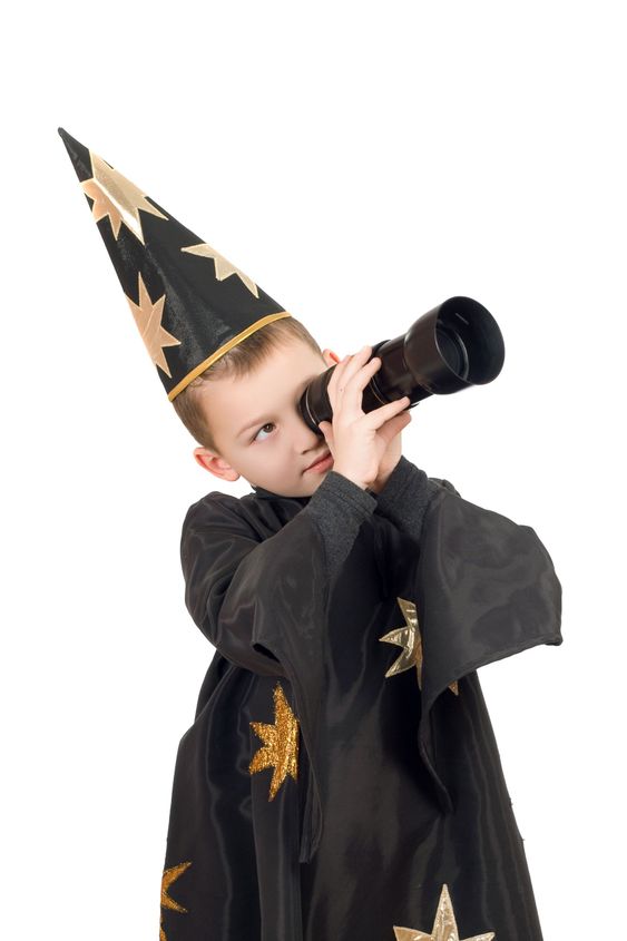 Boy dressed as astrologer. Isolated