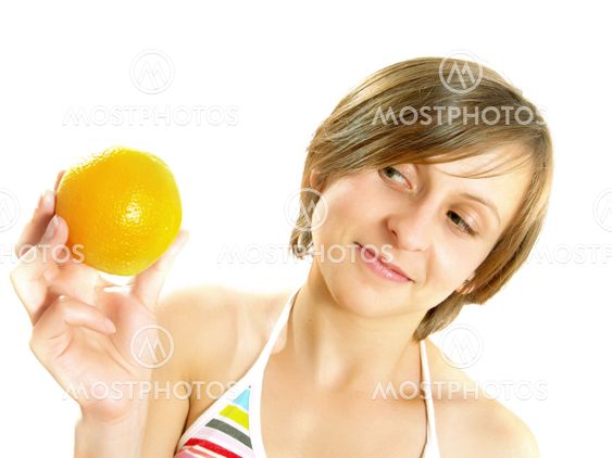 Smiling girl with a fresh orange