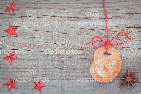 Christmas cookies and star anise. On textured wood.