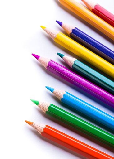 Colorful pencils arranged in a vibrant diagonal line on...