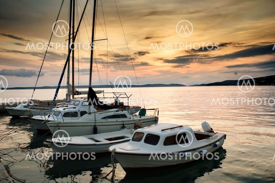 Fishing boats in Adriatic sea with sunset light