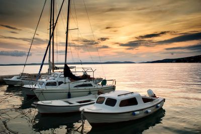 Fishing boats in Adriatic sea with sunset light