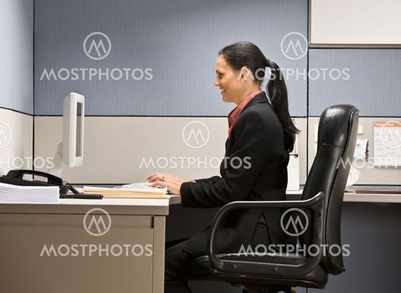 Businesswoman typing on computer